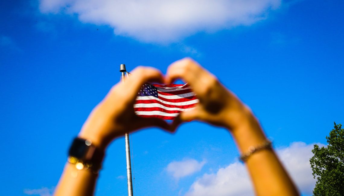 human hands and US flag