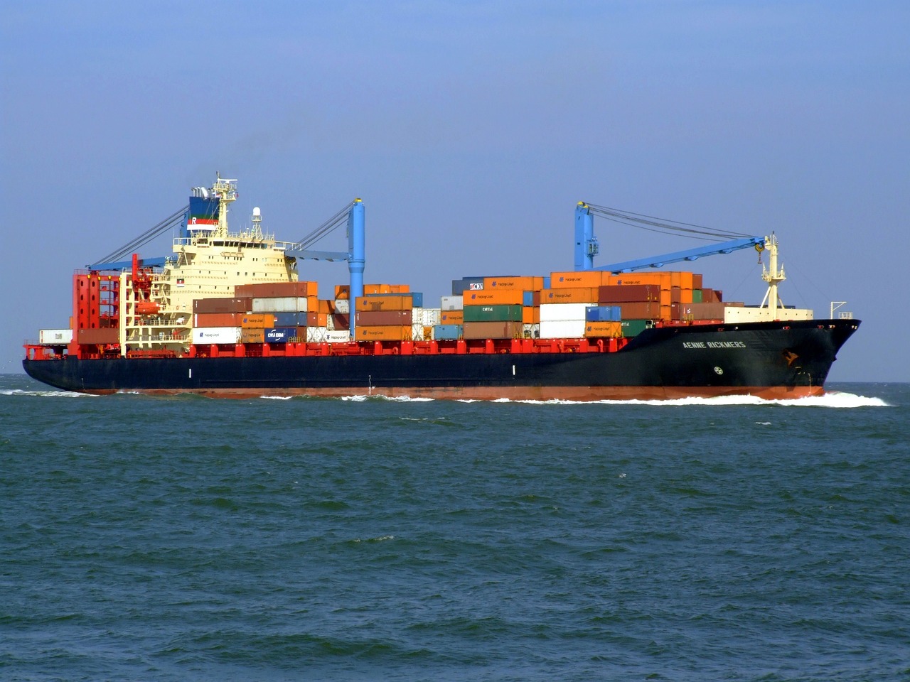 An ultra large container ship with refrigerated containers and steel boxes